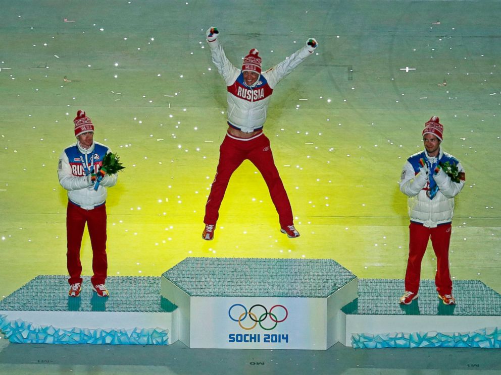 PHOTO: Russias medal winners pose during the medal ceremony for the mens 50-kilometer cross-country race during the closing ceremony of the 2014 Winter Olympics, Sunday, Feb. 23, 2014, in Sochi, Russia.