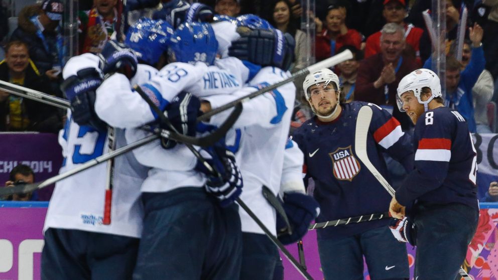 PHOTO: USA defenseman Justin Faulk and forward Joe Pavelski react as Finland celebrates a goal during the third period of the mens bronze medal ice hockey game at the 2014 Winter Olympics, Saturday, Feb. 22, 2014, in Sochi, Russia.