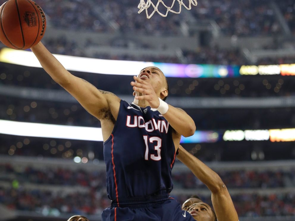 PHOTO: Connecticut guard Shabazz Napier drives to the basket during the first half of an NCAA Final Four tournament semifinal game, April 5, 2014, in Arlington, Texas.
