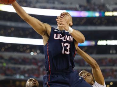 PHOTO: Connecticut guard Shabazz Napier drives to the basket during the first half of an NCAA Final Four tournament semifinal game, April 5, 2014, in Arlington, Texas.