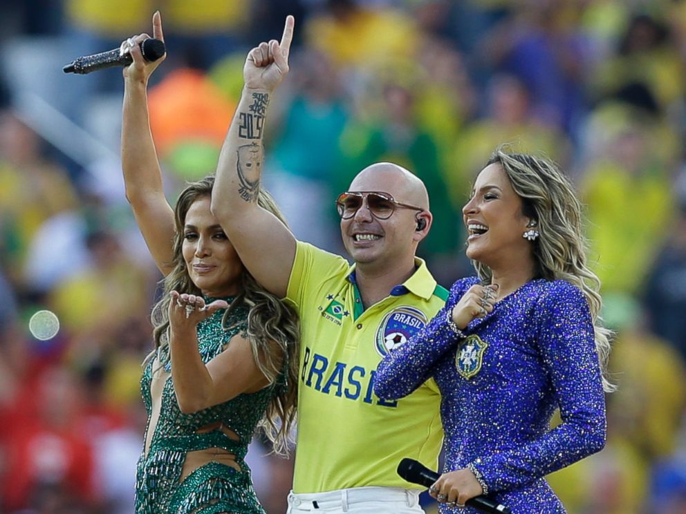 PHOTO: US singer Jennifer Lopez, left, rapper Pitbull and Brazilian singer Claudia Leitte perform during the opening ceremony in the Itaquerao Stadium in Sao Paulo, Brazil, June 12, 2014. 