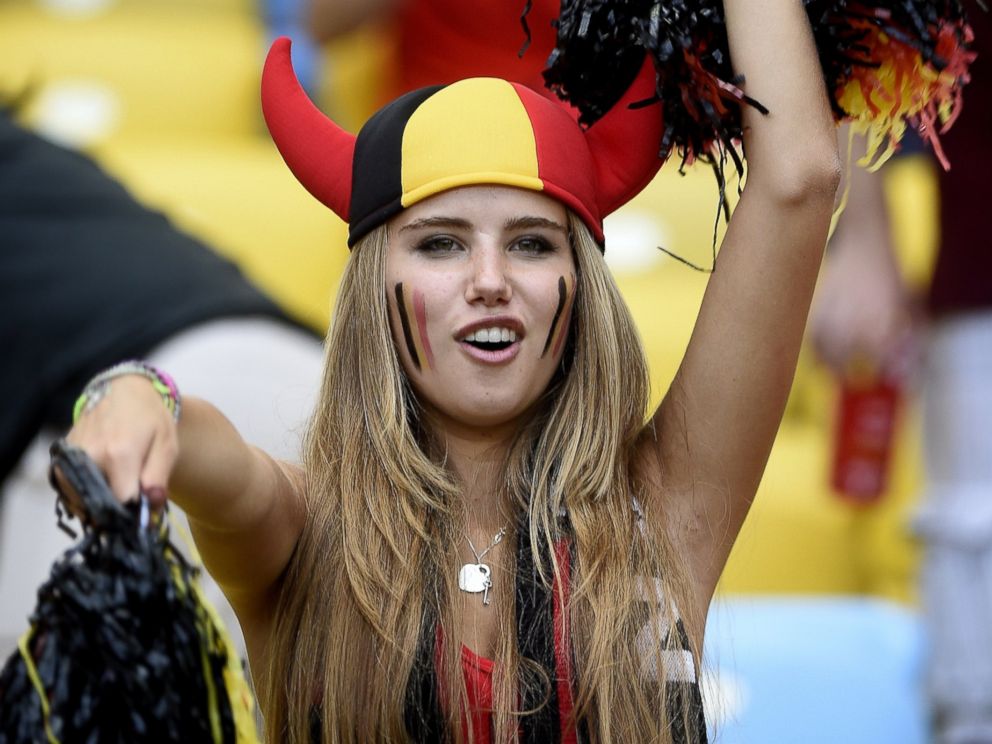 PHOTO: Axelle Despiegelaere, a Belgium fan poses as she waits for the start of the Group H football match between Belgium and Russia at the Maracana Stadium in Rio de Janeiro during the 2014 FIFA World Cup on June 22, 2014.