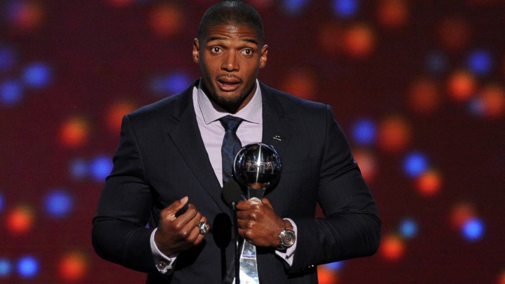 PHOTO: Michael Sam accepts the Arthur Ashe Courage Award onstage during the 2014 ESPYS