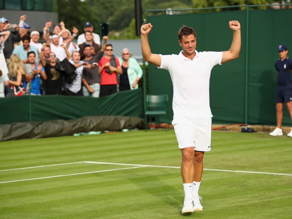 PHOTO: Marcus Willis celebrates upset victory during the Mens Singles first round match against Ricardas Berankis at Wimbledon on June 27, 2016 in London.
