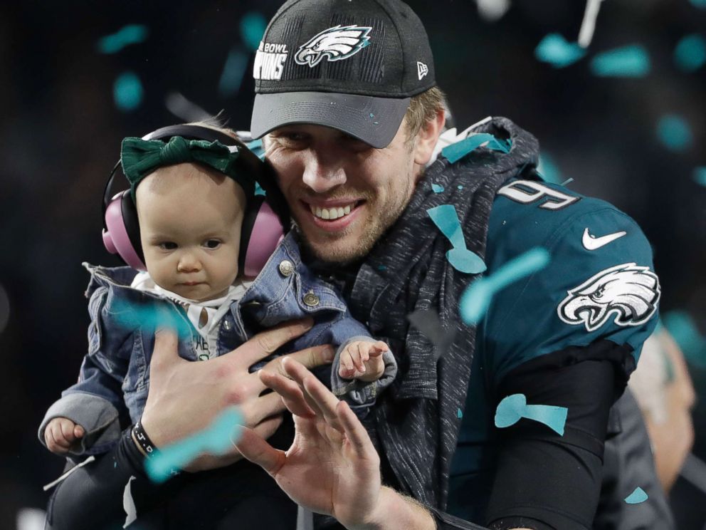 PHOTO: Philadelphia Eagles Nick Foles holds up his daughter, Lily after the NFL Super Bowl 52 football game against the New England Patriots, Feb. 4, 2018, in Minneapolis. 