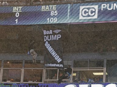 2 Protesters Rappel From Balcony at Colts-Panthers Game
