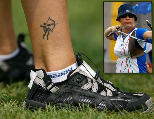 Italian world champion Natalia Valeeva showed off an archer tattoo on her 