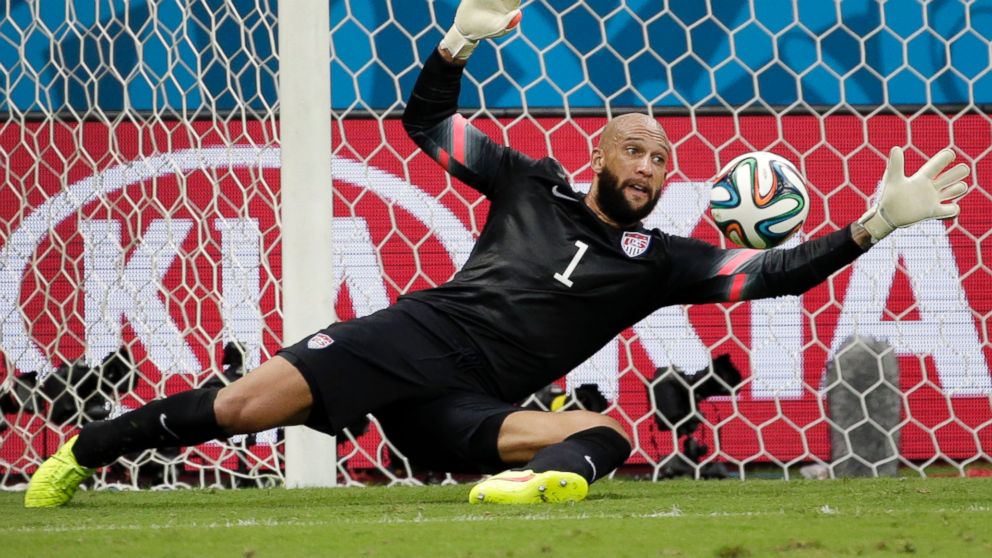 PHOTO: United States goalkeeper Tim Howard saves a shot by Belgium during the World Cup match between Belgium and the USA at the Arena Fonte Nova in Salvador, Brazil, July 1, 2014. 