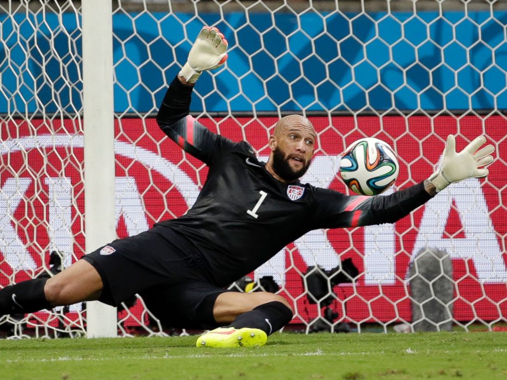 PHOTO: United States goalkeeper Tim Howard saves a shot by Belgium during the World Cup match between Belgium and the USA at the Arena Fonte Nova in Salvador, Brazil, July 1, 2014.