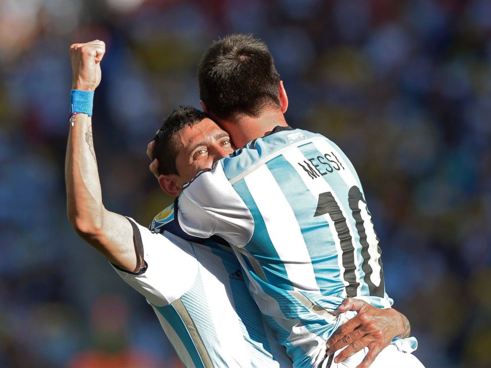 PHOTO: Argentinas Lionel Messi celebrates with Angel di Maria after di Maria scored his sides only and winning goal in extra time during the World Cup match between Argentina and Switzerland at the Itaquerao Stadium in Sao Paulo, Brazil, July 1, 2014.