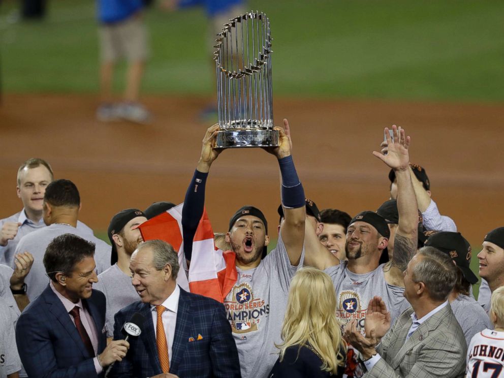 PHOTO: The Houston Astros Carlos Correa celebrates with the trophy after their win against the Los Angeles Dodgers in Game 7 of baseballs World Series Wednesday, Nov.&nbsp;1,&nbsp;2017, in Los Angeles. The Astros won 5-1 to win the series 4-3.