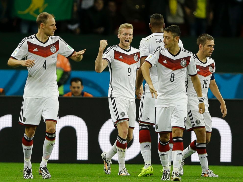 PHOTO: Germanys Andre Schuerrle (9) celebrates with his teammates during the World Cup match between Germany and Algeria at the Estadio Beira-Rio in Porto Alegre, Brazil, June 30, 2014.