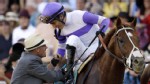 PHOTO:&nbsp;Jockey Mario Gutierrez, top, aboard I'll Have Another, is congratulated by bloodstock agent Dennis O'Neill, brother of I'll Have Another's trainer Doug O'Neill, after winning the 137th Preakness Stakes horse race May 19, 2012, at Pimlico.