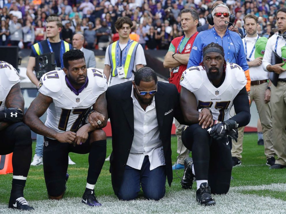 PHOTO: (L-R) Baltimore Ravens wide receiver Mike Wallace, former player Ray Lewis and inside linebacker C.J. Mosley lock arms and kneel down during the playing of the U.S. national anthem in London, Sept. 24, 2017.