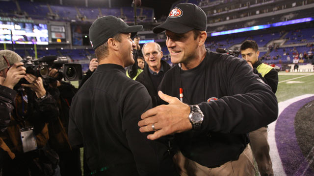 PHOTO: Head Coach Jim Harbaugh of the San Francisco 49ers embraces his brother Head Coach John Harbaugh of the Baltimore Ravens prior to the game at M&T Bank Stadium, Nov. 24, 2011, in Baltimore.