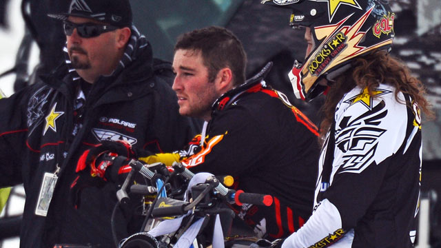 PHOTO: Caleb Moore, center, watches practice for Snowmobile Freestyle, Jan. 24, 2013, during the 2013 Winter X Games in Aspen.