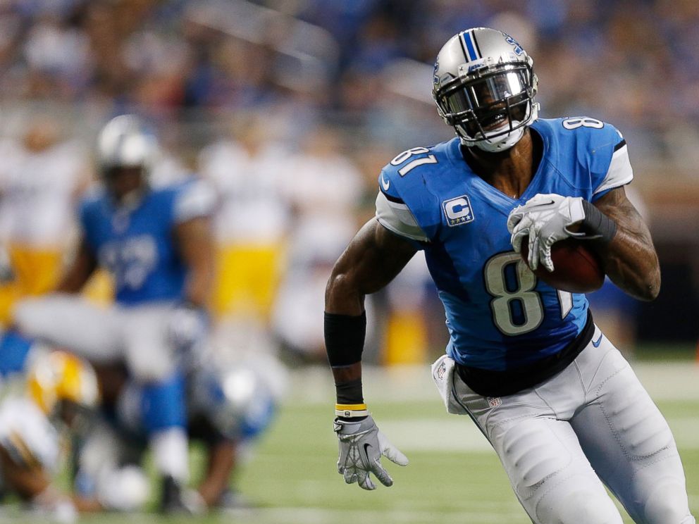 PHOTO: Calvin Johnson of the Detroit Lions runs for a third quarter touchdown at Ford Field on Nov. 28, 2013 in Detroit, Michigan.