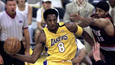 PHOTO: Kobe Bryant, of the Los Angeles Lakers passes the ball during one of the NBA Western Conference finals in Los Angeles, May 20, 2000.