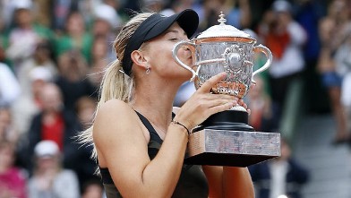 PHOTO: Maria Sharapova holds her trophy after winning the Women's Singles final at the French Open held at the Roland Garros stadium, Paris, FR., June 9, 2012.