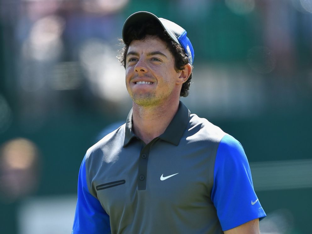 PHOTO: Rory McIlroy of Northern Ireland walks off the 18th green during the first round of The 143rd Open Championship at Royal Liverpool on July 17, 2014 in Hoylake, England.