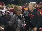 Jake Olson with USC Coach Pete Carroll and members of the football team.