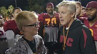 Jake Olson with USC Coach Pete Carroll and members of the football team.