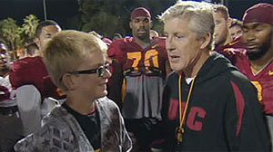 Jake Olson with USC Coach Pete Carroll and members of the football team.