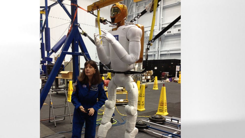 PHOTO: NASA astronaut Cady Coleman with Robonaut.