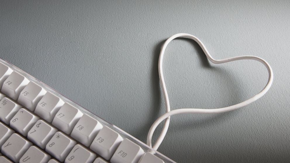 PHOTO: Image of computer keyboard with heart-shape wire.