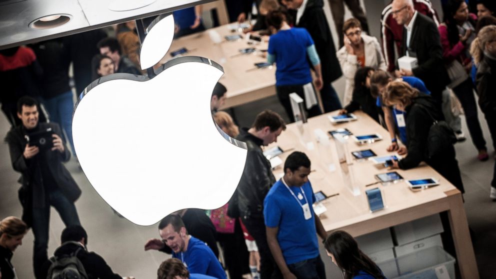 PHOTO: Customers test the IPad, April 4, 2012, at the Apple store inside the Confluence shopping centre in Lyon, France. 