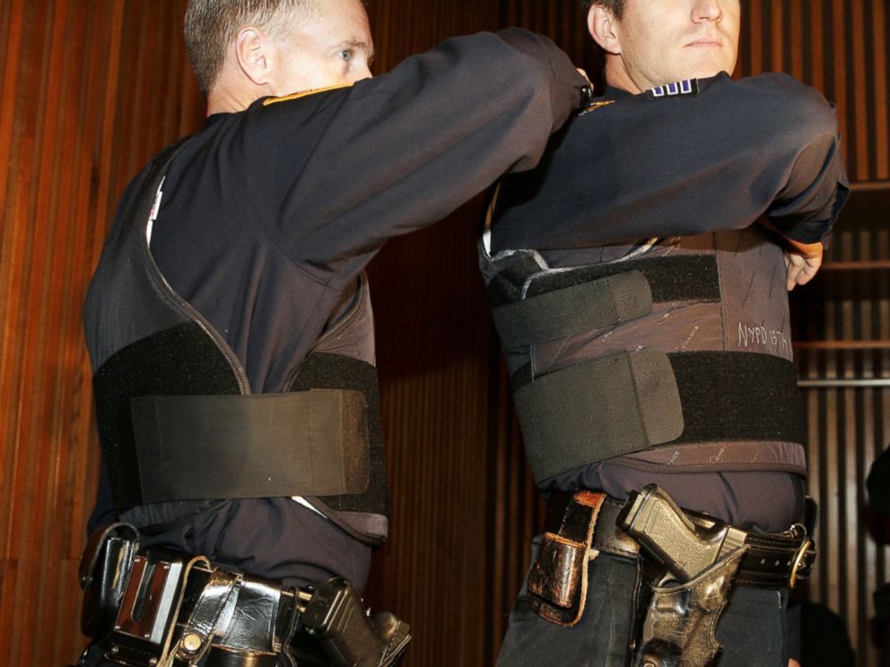 PHOTO: Sgt. John Kirrane, right, models the new NYPD vest with added protection on the sides with overlapping Kevlar.