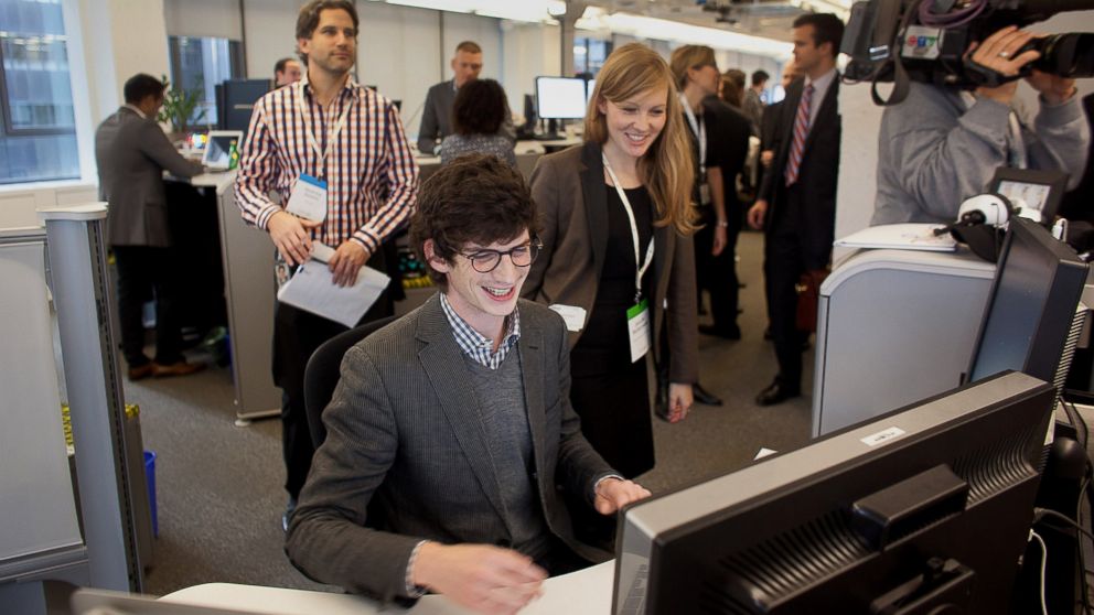 PHOTO: Employees smile while working during a media tour for the grand opening of Google Inc.s new office in Toronto, Nov. 13, 2012.