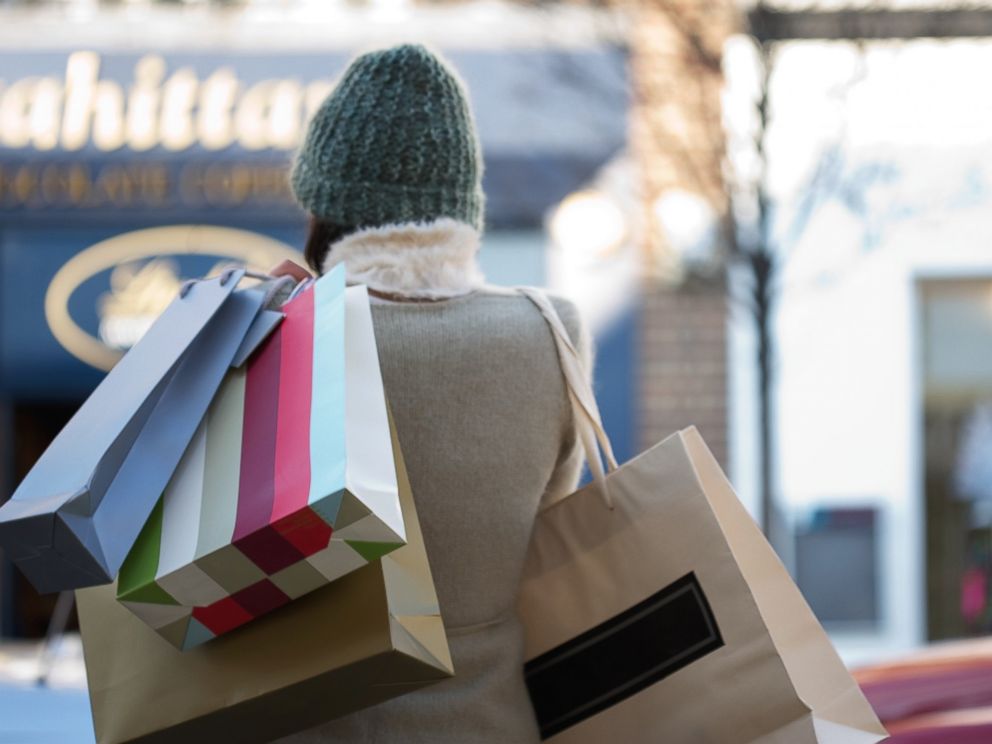 PHOTO:A woman is pictured holding shopping bags in this undated file photo.