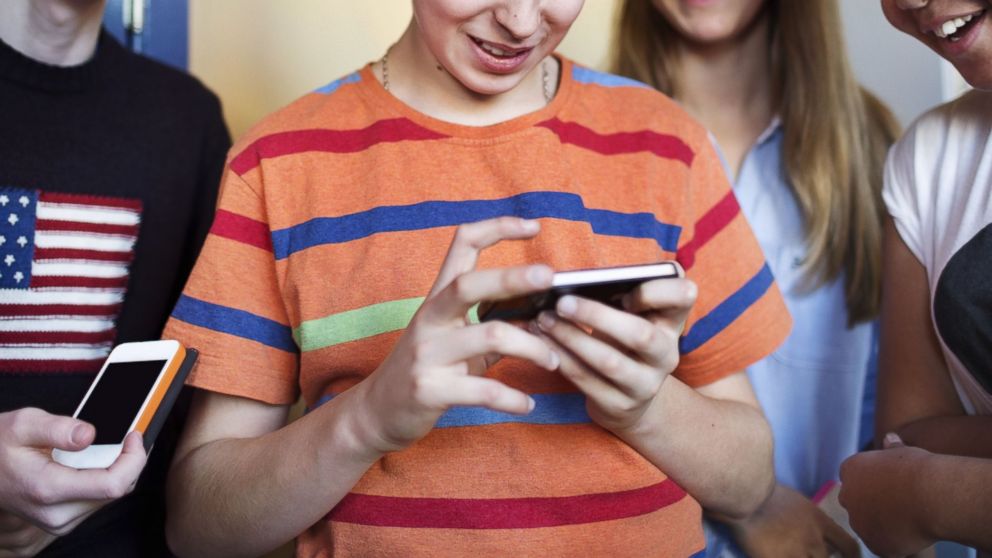 PHOTO: High school students are pictured using smartphones in this stock image.