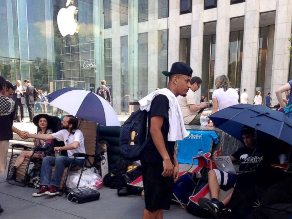 PHOTO: People wait outside of the flagship Apple Store in New York City, hoping to be the first to get their hands on any new electronics Apple may release.