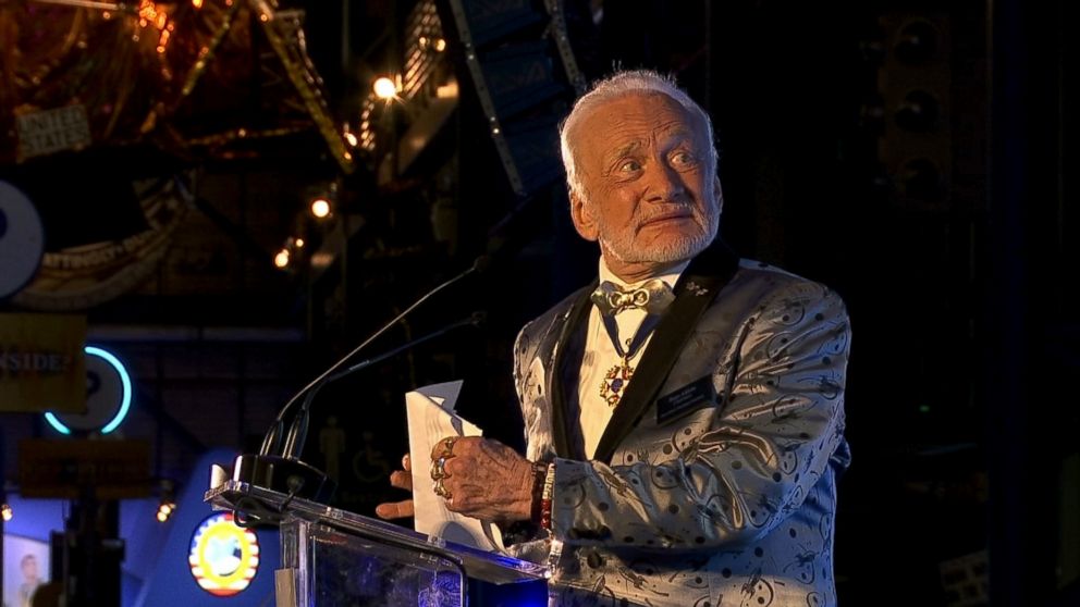 Astronaut Buzz Aldrin rolls out the red carpet for Mars