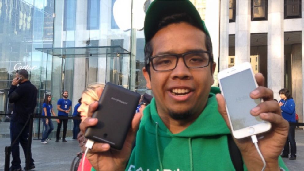 PHOTO: Eduardo Campos was the first person out the door of Apples flagship store in New York City with the new iPhone 6.