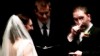 Video: Wedding couple updates their facebook status at the altar.