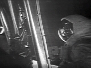 Armstrong Reads Plaque Dedicated To Mission