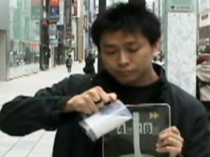 VIDEO: A Japanese street performer develops a series of magic tricks involving the iPad.
