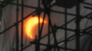 PHOTO:&nbsp;A partial annular solar eclipse appears through construction scaffoldings in Beijing, China, Monday, May 21, 2012.