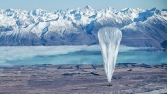 A Google balloon sails through the air with the Southern Alps mountains in the background, in Tekapo, New Zealand, on June 10, 2013.