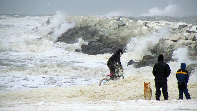 PHOTO: Nome kids plays in sea foam near the Nome harbor, Nov. 8, 2011 as the big Bering Sea storm starts kicking up in Nome, Alaska.