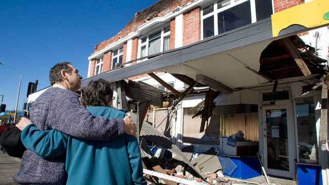 PHOTO: People look at damaged buildings after a 7.1 magnitude earthquake struck 30km west of the city on the morning of Sept. 4, 2010 in Christchurch, New Zealand.