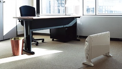 PHOTO: Buying a space heater for your desk at work can keep you warm.