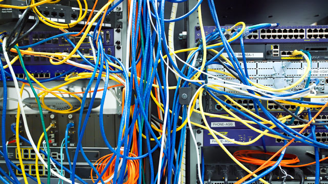 PHOTO: A tangled mess of network cables.