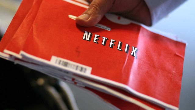 PHOTO: A U.S. Postal worker holds a stack of Netflix envelopes at the U.S. Post Office sort facility, San Francisco, CA., Oct. 24, 2011.