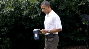 PHOTO: President Barack Obama carries a computer tablet as he walks from the Oval Office in this Aug. 13, 2011 file photo.