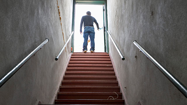 PHOTO: Getting up and walking around the office or up and down the stairs in your office building can help keep you warm.
