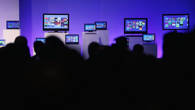 PHOTO: People sit in front of devices running the Microsoft Windows 8 operating system at a press conference launch of the system, Oct. 25, 2012, in New York City.
